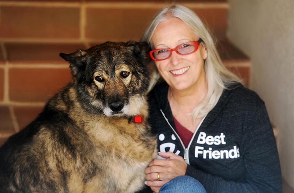 Silva Battista next to a dog wearing a Best Friends sweatshirt