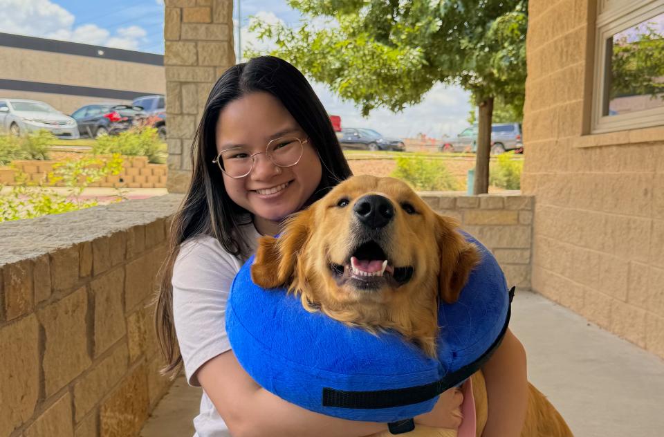 Christine Morey hugging a dog