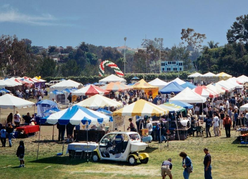 Outdoor festival with colorful tents