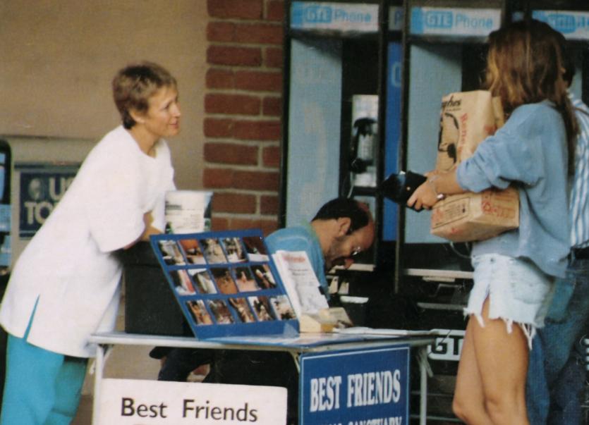 Vintage photo of people at donation table