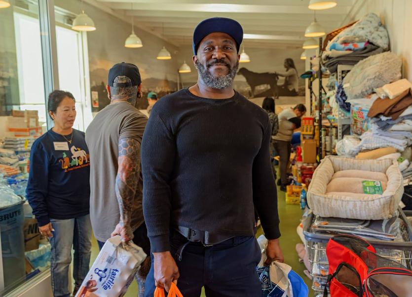 Community member helping with shelter donations.