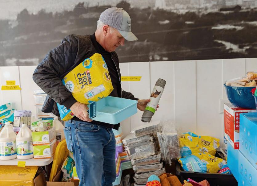 Volunteer sorting through donations.