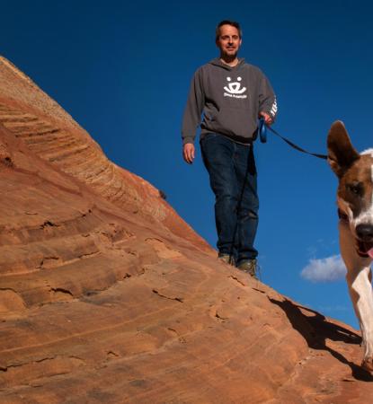 dog hiking with man