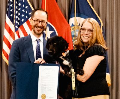 Holly Sizemore holding a dog at the Nashville proclamation