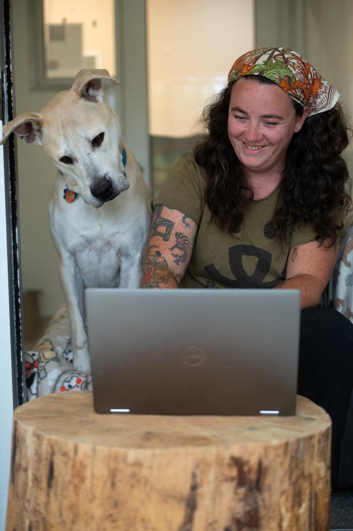 Mr. Bowser the dog looking at a laptop computer with Claire