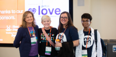 Four attendees to the 2022 Best Friends National Conference pose for a photo
