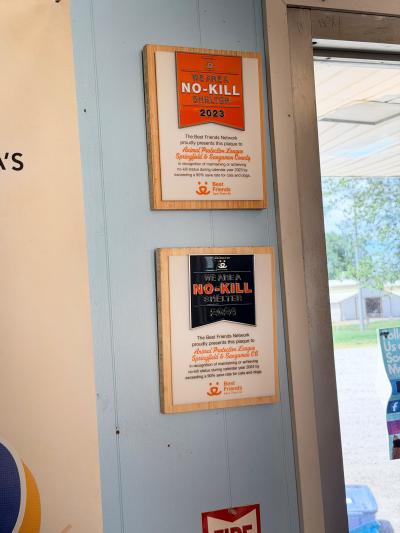 Two no-kill plaques on the wall