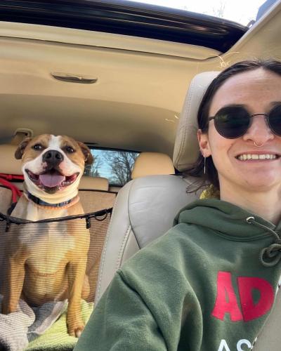 Selfie of a person with Chase the dog in the backseat of a vehicle