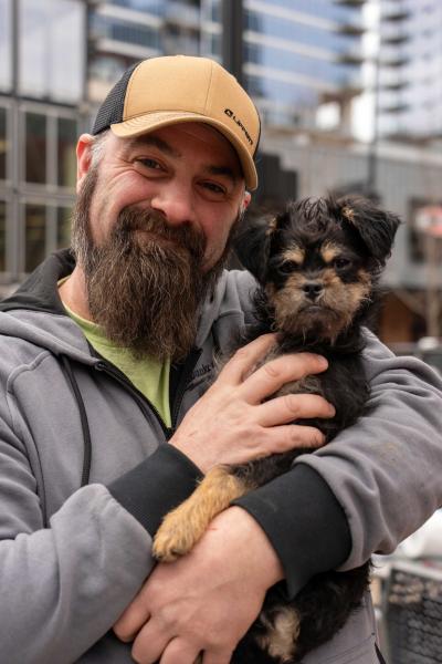 Riley, a volunteer with The Humane Society of Greater Kansas City, poses with his beard-twin, Tiny Tot.