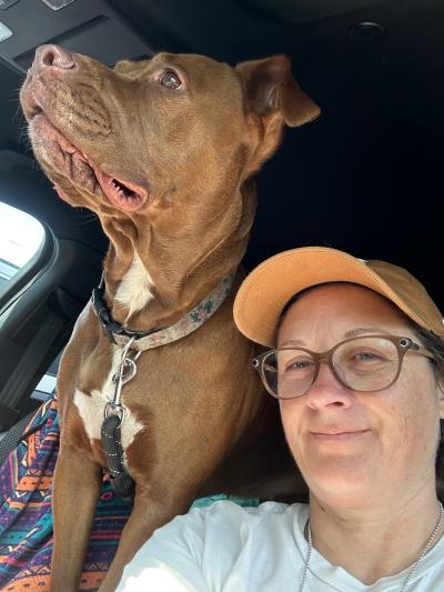 Selfie of Patty with Bonnie the dog in a vehicle