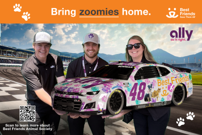 Photo of people with the No. 48 racecar taken from the green screen at Pocono Raceway