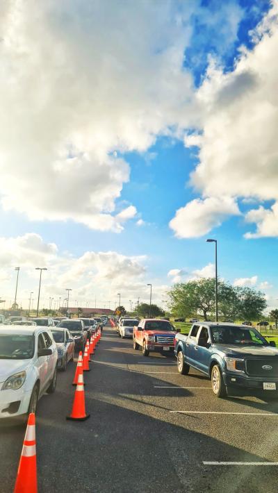 Line of cars waiting for services for their pets at the 12-hour vaccination clinic