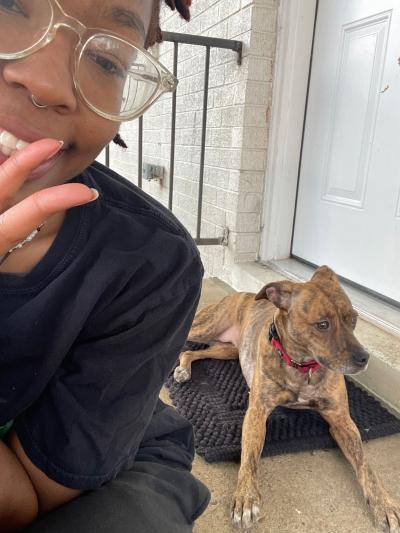 K’Terra Nunn selfie with Salsa the dog in the bakground