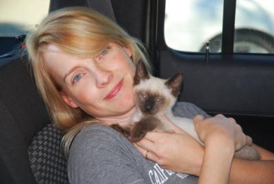 Dr. Heather Kennedy holding Calvin the Siamese kitten