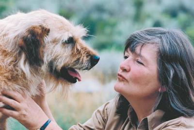 Faith Maloney with Obi the scruffy brown dog