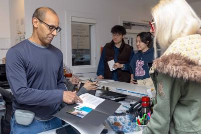 Robert Lobo volunteering at the front desk