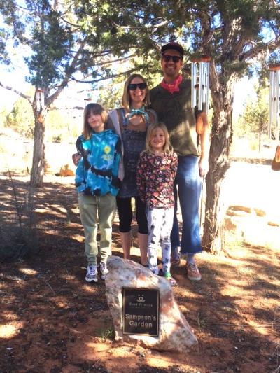 The Williams family in Angels Rest by a marker on a stone for Sampson's Garden