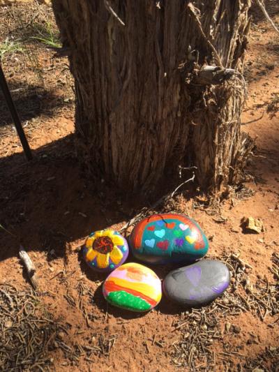Painted stones at a memorial at Angels Rest