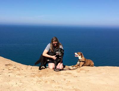 Emily with Charlie and Buster the dogs on the beach