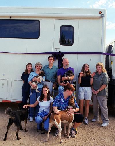 Julie Castle and other people beside the No More Homeless Pets vaccine and wellness clinic