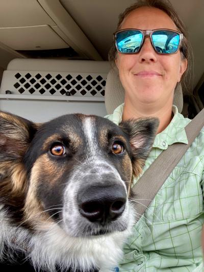 Heather Hall in a vehicle with a dog