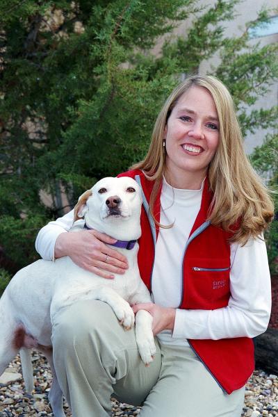 Young Julie Castle with a dog