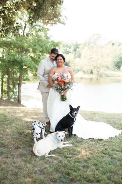 Outdoor wedding photo that includes the three dogs, including Cooper
