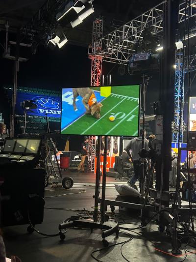 Bianca the puppy on a television screen on the Puppy Bowl set