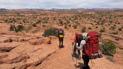A few people in a wide desert