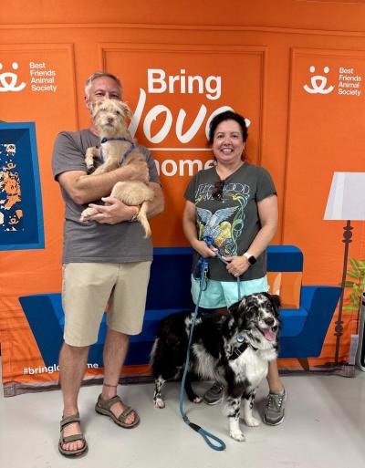 Cindy and Jeff adopting Tator and Bailey the dogs