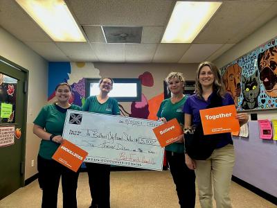 Staff from the Bullhead City Animal Shelter holding an oversized check from Best Friends