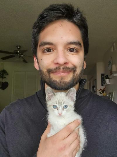 Justin Serna holding a kitten