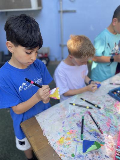 Students preparing items to be sold at the market to benefit Best Friends