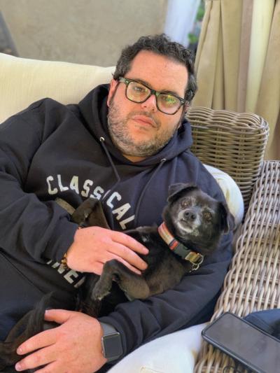 Josh Gad holding his dog Didi
