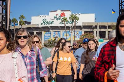 Super adoption crowd in front of Rose Bowl signage