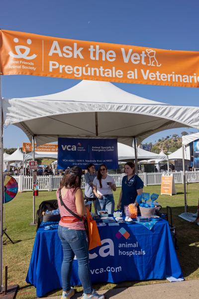 Ask the Vet booth with people at the Los Angeles Super Adoption event