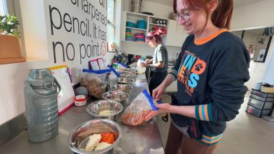 Landon and Jamie prepping Thanksgiving for the dogs