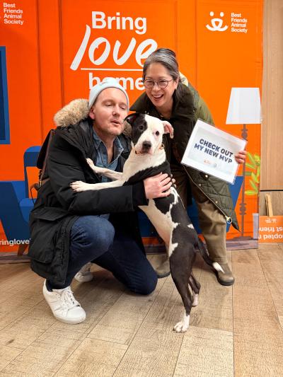 David and Heather with Maggie the dog during her adoption