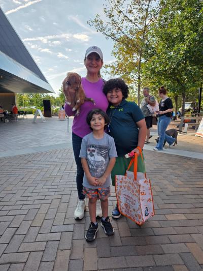 Mars the puppy being adopted by a family