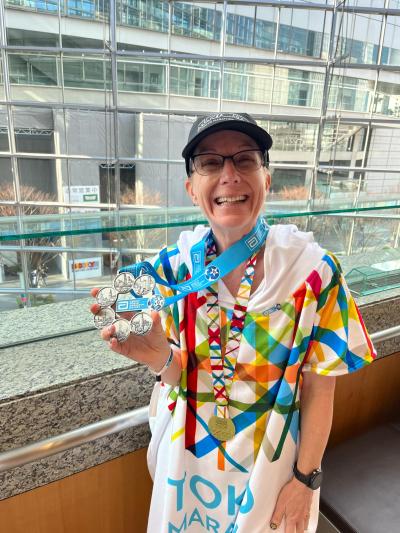 Michelle Hood wearing multiple medals around her neck