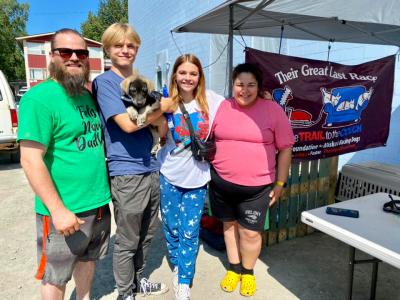 Family adopting their puppy from The August Fund
