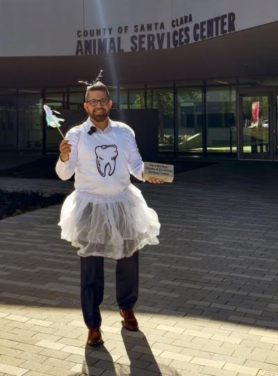Edgar Nolasco dressed up as the tooth fairy in front of Santa Clara Animal Services