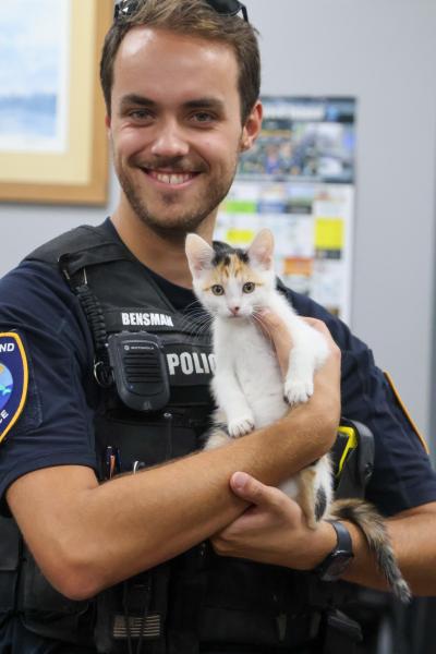 Tybee Island Police Department officer holding Samoa the kitten