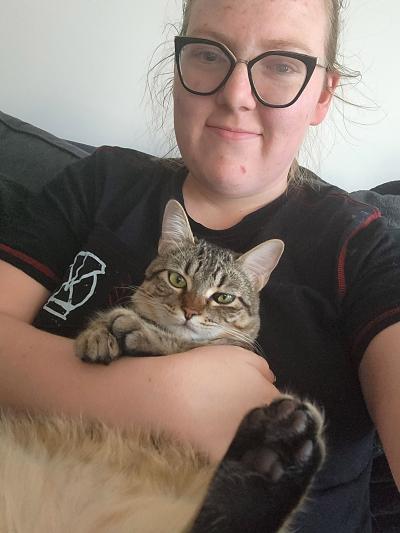 Elizabeth holding Vex’ahlia the cat on her lap