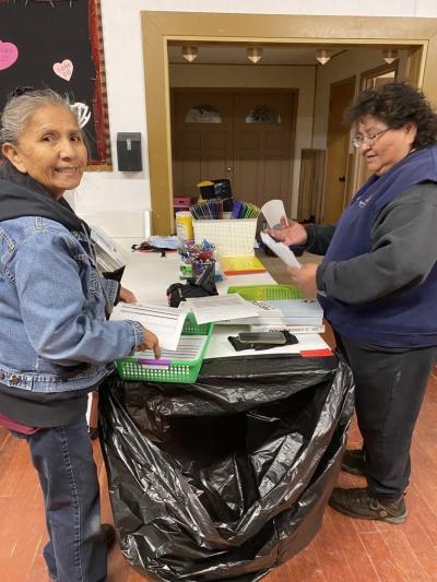 Two people working on paperwork