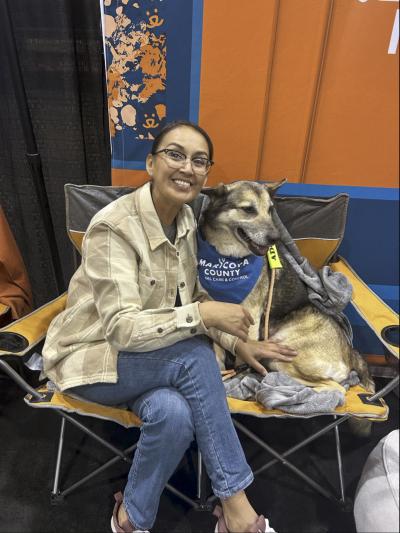 Joni Lapahie sitting beside a dog