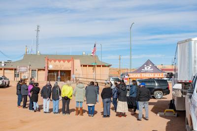 Group of people with their pets gathering for a Navajo Nation mobile clinic