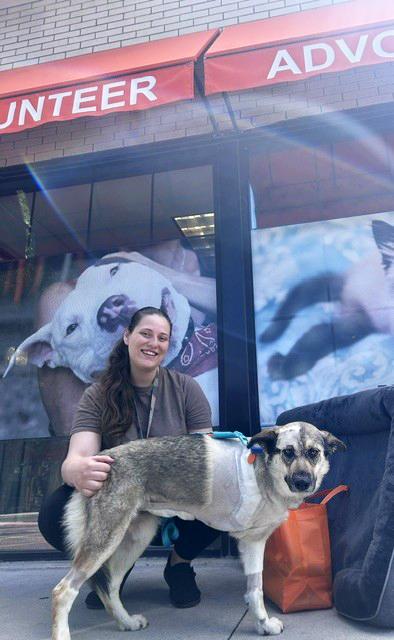 Kiyro Erickson and Oakley in front of the Best Friends Pet Adoption Center in Salt Lake City