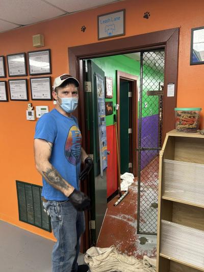 Person at the shelter wearing a mask and gloves