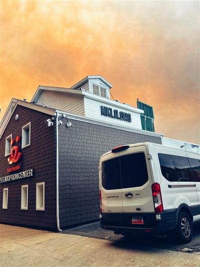 The Best Friends Pet Adoption Center in Los Angeles with smoke and glow from the fires behind it